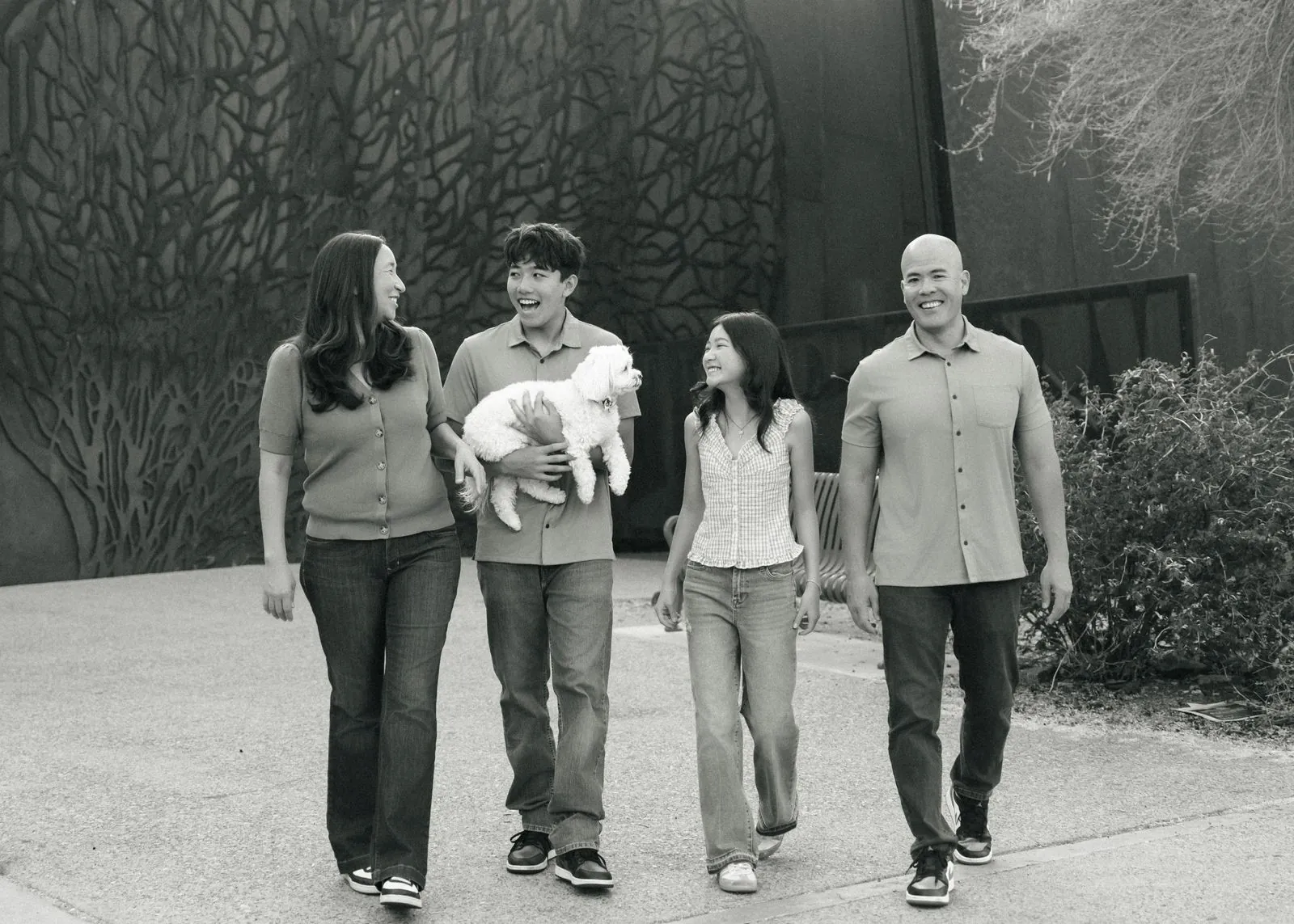 Black and white photo of a family walking together