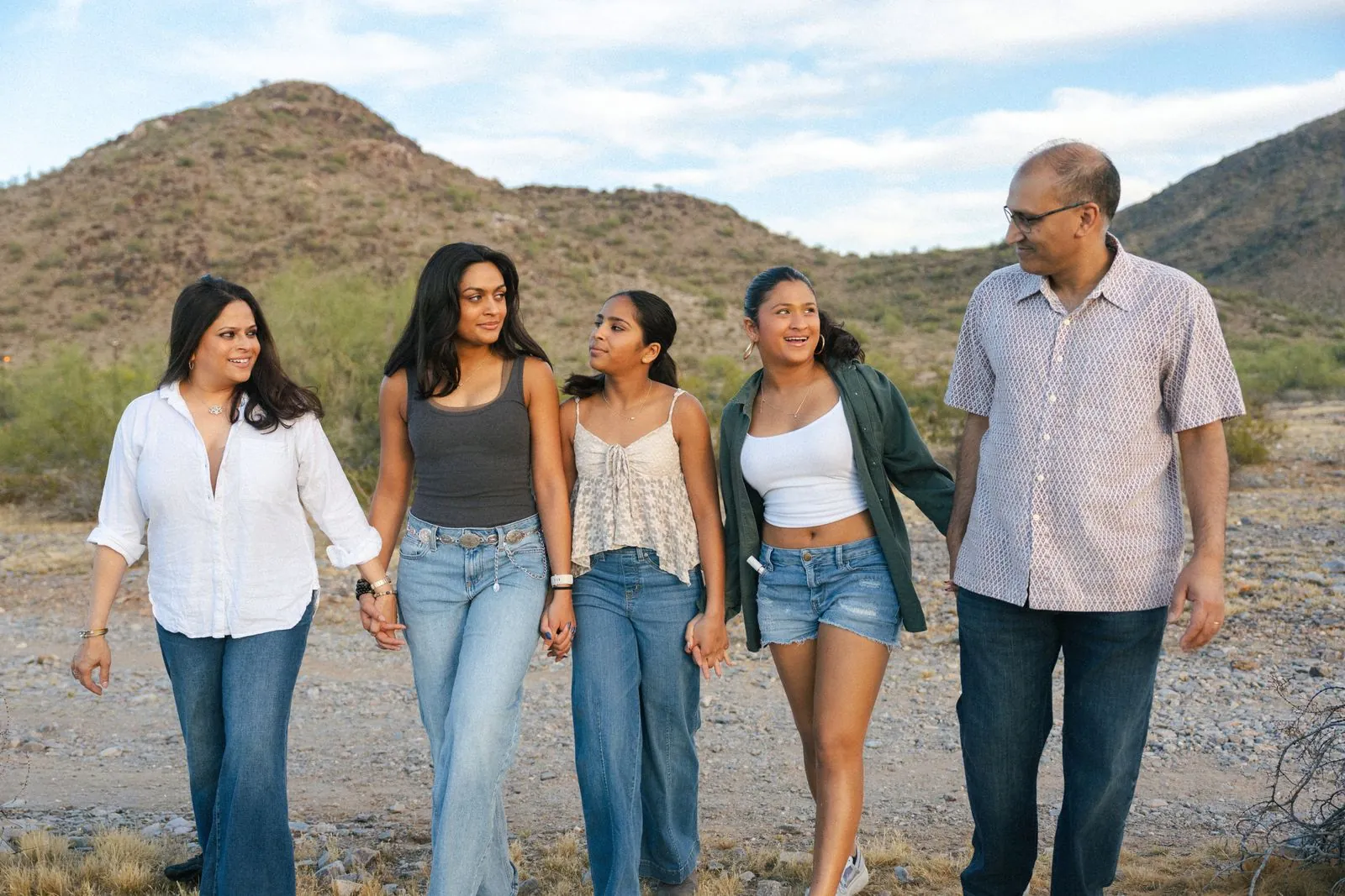 Family walking together through the desert