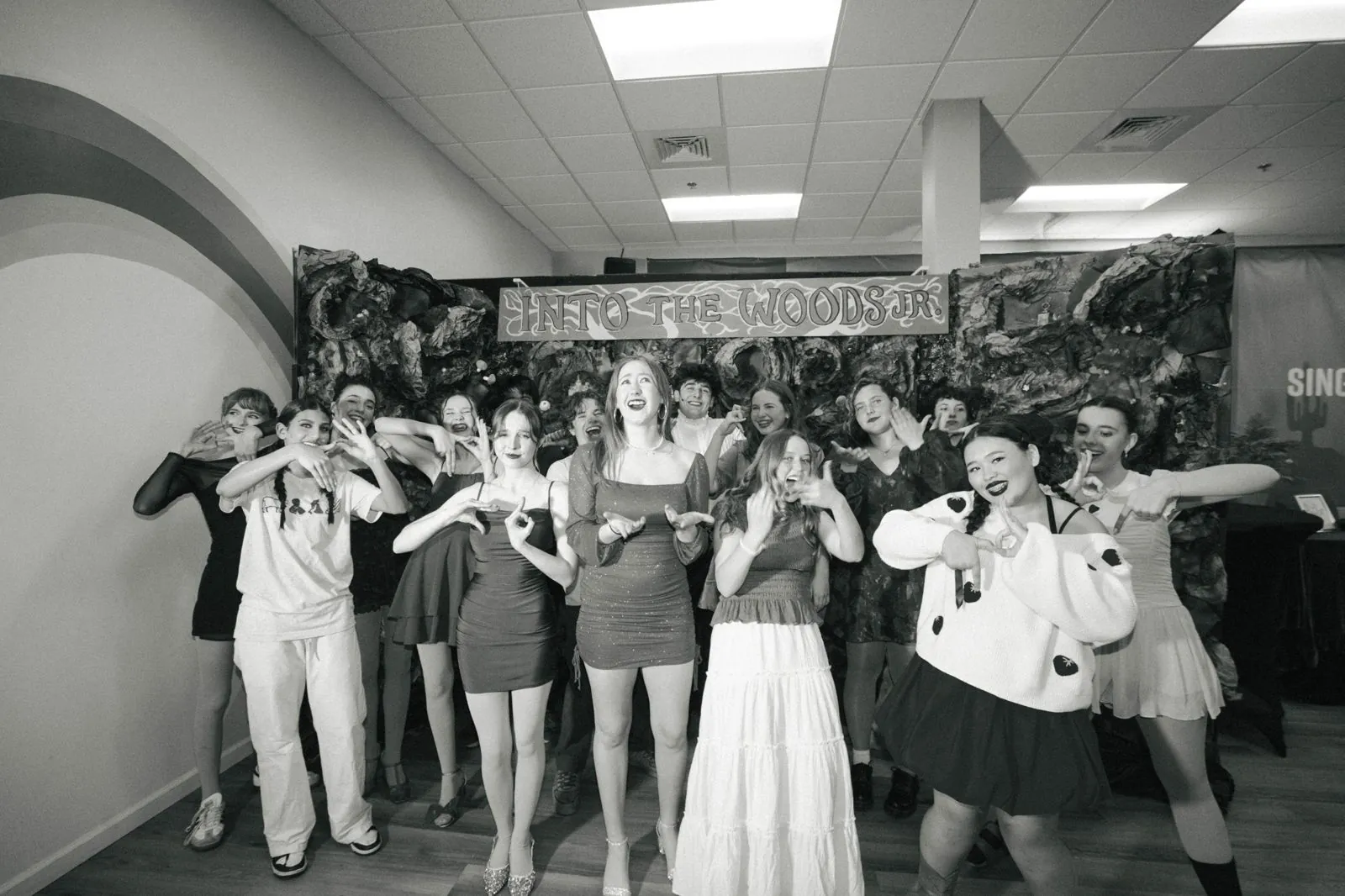 Youth theatre cast posing together after the show